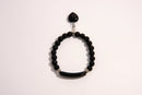 Raw Earth Crystals black onyx bracelet with raw stone accent, made from natural crystal, supports protection, grounding, and emotional stability.
