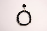 Raw Earth Crystals black onyx bracelet with raw stone accent, made from natural crystal, supports protection, grounding, and emotional stability.