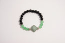 Raw Earth Crystals black onyx and green aventurine bracelet with silver accent, crafted from natural crystals, promotes balance, prosperity, and emotional harmony.