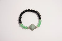 Raw Earth Crystals black onyx and green aventurine bracelet with silver accent, crafted from natural crystals, promotes balance, prosperity, and emotional harmony.