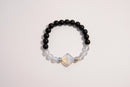 Raw Earth Crystals black onyx and opal bracelet with silver accent, crafted from natural crystals, promotes grounding, emotional balance, and inner peace.