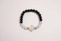 Raw Earth Crystals black onyx and opal bracelet with silver accent, crafted from natural crystals, promotes grounding, emotional balance, and inner peace.