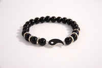 Raw Earth Crystals black tourmaline bracelet with yin yang design, made from natural crystal, supports balance, protection, and spiritual harmony.