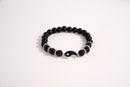 Raw Earth Crystals black tourmaline bracelet with yin yang design, made from natural crystal, supports balance, protection, and spiritual harmony.
