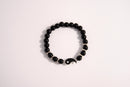 Raw Earth Crystals black tourmaline bracelet with yin yang design, crafted from natural crystal, promotes balance, protection, and inner clarity.