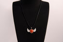 Raw Earth Crystals carnelian heart with wings necklace, featuring a vibrant orange-red heart-shaped stone adorned with delicate angelic wings, designed to boost energy, enhance motivation, and support emotional strength.