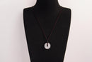 Raw Earth Crystals clear quartz disc pendant necklace featuring a natural crystal for balance, clarity, and spiritual protection.