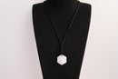 Raw Earth Crystals clear quartz geometric pendant necklace made with natural crystal for clarity, amplification, and spiritual alignment.