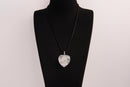 Raw Earth Crystals clear quartz heart pendant with an elegant rose design, featuring a delicate silver-tone stem and leaves embedded in natural clear quartz, promoting clarity, love, and spiritual connection.