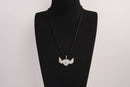 Raw Earth Crystals clear quartz heart with wings necklace, featuring a luminous heart-shaped stone adorned with angelic wings, designed to amplify energy, enhance clarity, and offer spiritual protection.