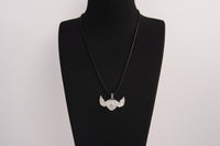 Raw Earth Crystals clear quartz heart with wings necklace, featuring a luminous heart-shaped stone adorned with angelic wings, designed to amplify energy, enhance clarity, and offer spiritual protection.