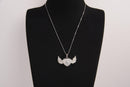 Raw Earth Crystals clear quartz heart with wings necklace, featuring a luminous heart-shaped stone adorned with angelic wings, designed to amplify energy, enhance clarity, and offer spiritual protection.
