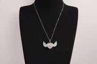 Raw Earth Crystals clear quartz heart with wings necklace, featuring a luminous heart-shaped stone adorned with angelic wings, designed to amplify energy, enhance clarity, and offer spiritual protection.