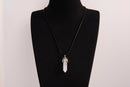 Raw Earth Crystals clear quartz necklace with a pointed natural stone pendant, designed to enhance clarity, amplify energy, and support spiritual awareness.