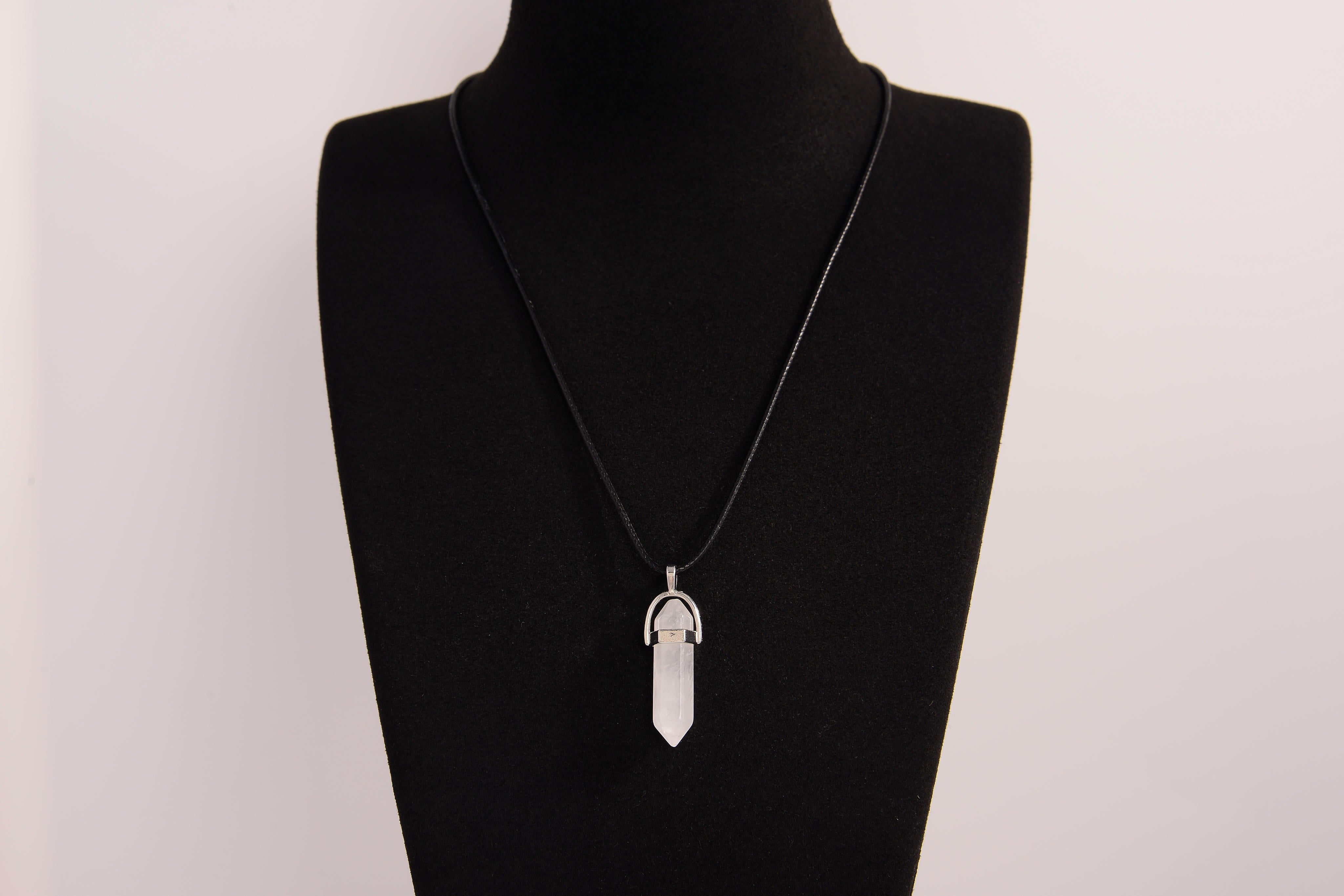 Raw Earth Crystals clear quartz necklace with a pointed natural stone pendant, designed to enhance clarity, amplify energy, and support spiritual awareness.