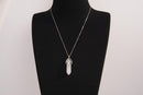 Raw Earth Crystals clear quartz necklace with a pointed natural stone pendant, designed to enhance clarity, amplify energy, and support spiritual awareness.