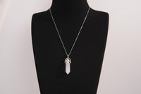 Raw Earth Crystals clear quartz necklace with a pointed natural stone pendant, designed to enhance clarity, amplify energy, and support spiritual awareness.