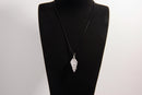Raw Earth Crystals clear quartz pendant with a spiral wire wrap design, crafted from natural stone to enhance clarity, focus, and spiritual energy.
