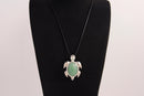 Raw Earth Crystals green aventurine turtle necklace made from natural crystal to attract prosperity, calm the heart, and support emotional balance.
