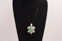 Raw Earth Crystals green aventurine turtle necklace made from natural crystal to attract prosperity, calm the heart, and support emotional balance.