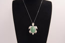 Raw Earth Crystals green aventurine turtle necklace made from natural crystal to attract prosperity, calm the heart, and support emotional balance.