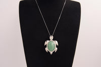 Raw Earth Crystals green aventurine turtle necklace made from natural crystal to attract prosperity, calm the heart, and support emotional balance.
