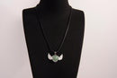 Raw Earth Crystals green aventurine heart with wings necklace, featuring a vibrant green heart-shaped stone adorned with delicate angelic wings, designed to promote abundance, emotional balance, and spiritual growth.