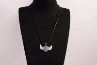 Raw Earth Crystals green aventurine heart with wings necklace, featuring a vibrant green heart-shaped stone adorned with delicate angelic wings, designed to promote abundance, emotional balance, and spiritual growth.