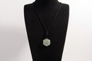 Raw Earth Crystals green aventurine necklace with a faceted natural stone pendant, designed to enhance emotional balance, promote calmness, and support personal growth.