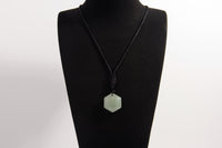 Raw Earth Crystals green aventurine necklace with a faceted natural stone pendant, designed to enhance emotional balance, promote calmness, and support personal growth.