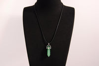 Raw Earth Crystals green aventurine necklace with a pointed natural stone pendant, designed to promote emotional balance, enhance luck, and support personal growth.