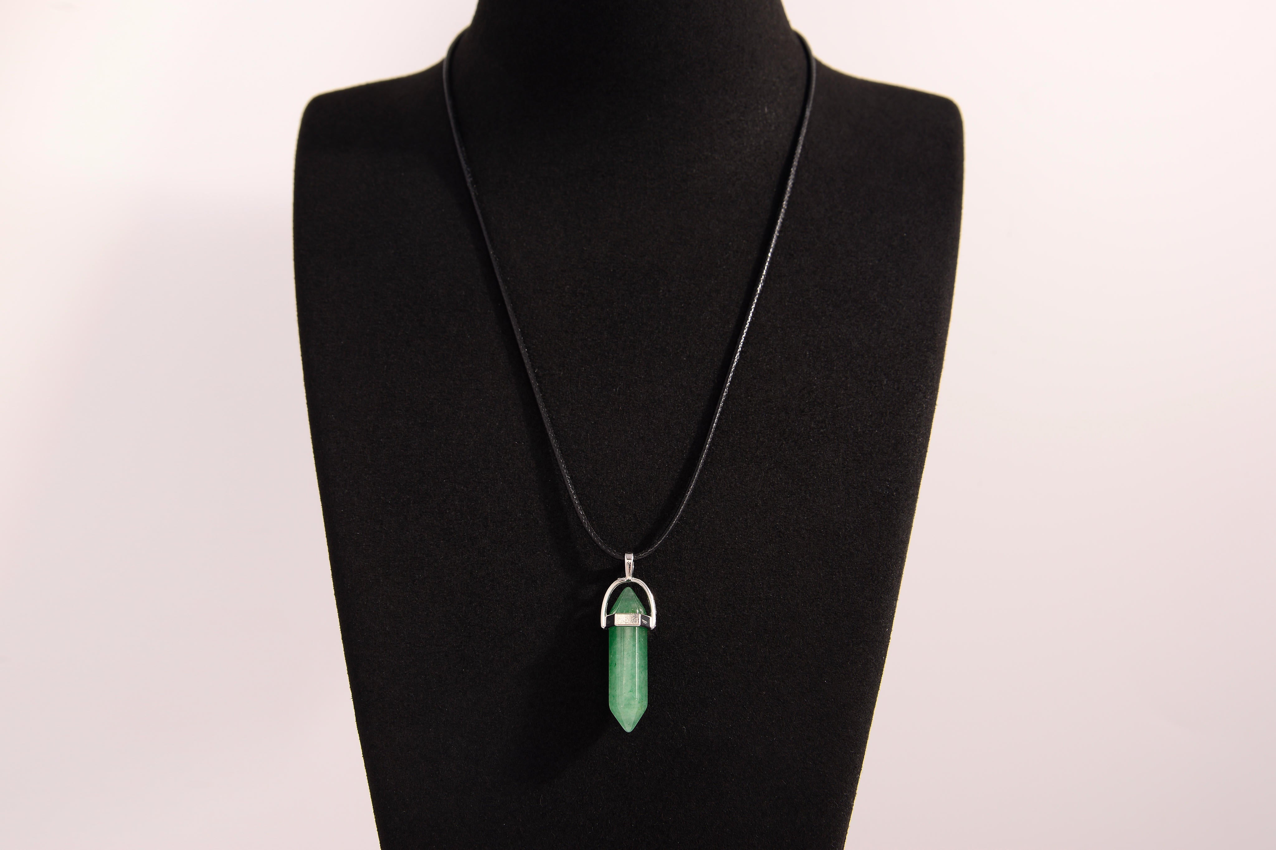 Raw Earth Crystals green aventurine necklace with a pointed natural stone pendant, designed to promote emotional balance, enhance luck, and support personal growth.