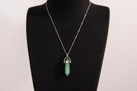 Raw Earth Crystals green aventurine necklace with a pointed natural stone pendant, designed to promote emotional balance, enhance luck, and support personal growth.