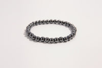 Hematite beaded bracelet from Raw Earth Crystals, featuring natural gemstones for grounding, mental clarity, and protective energy.
