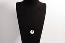 Raw Earth Crystals howlite disc pendant necklace made with natural crystal for calmness, patience, and emotional balance.