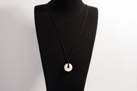 Raw Earth Crystals howlite disc pendant necklace made with natural crystal for calmness, patience, and emotional balance.