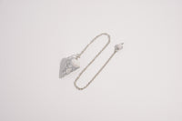 Raw Earth Crystals howlite pendulum with pointed crystal and silver chain, designed for emotional balance, patience, and mental clarity.