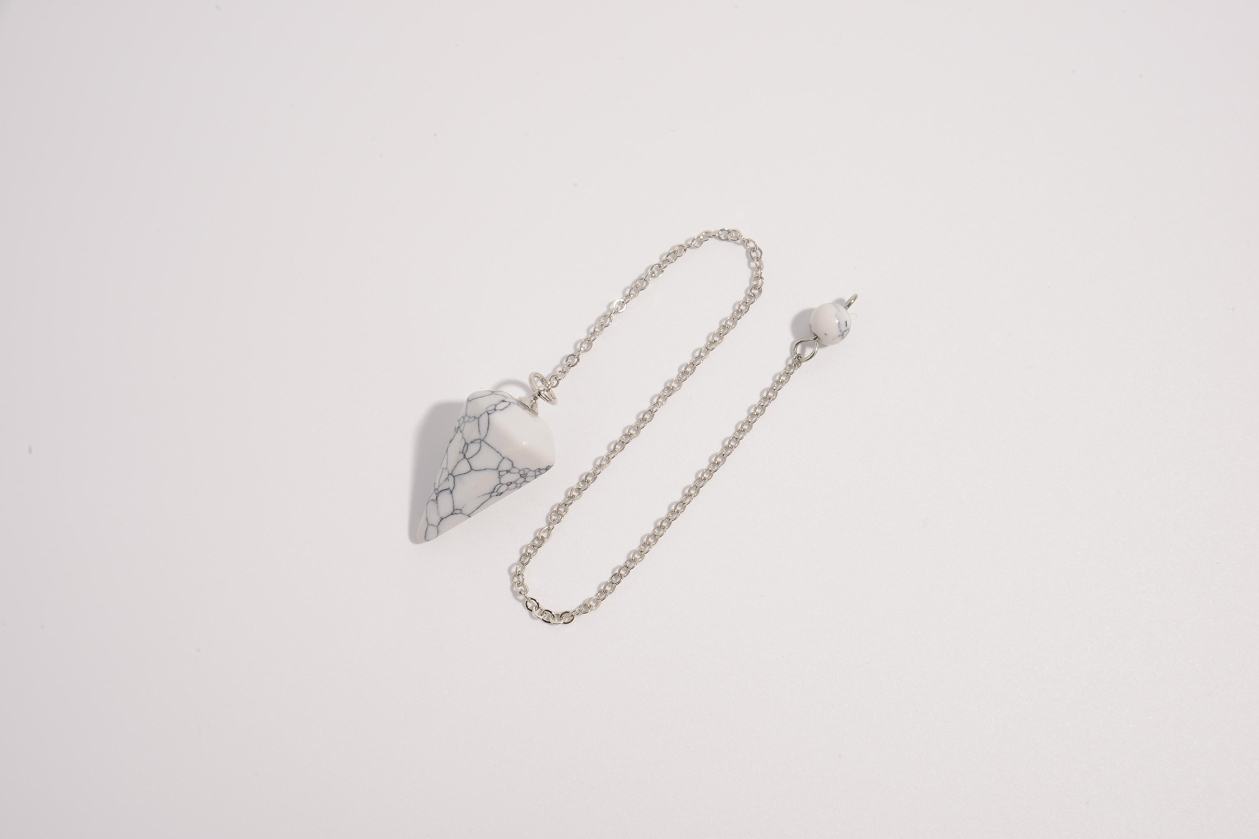 Terminated Crystal Pendulums