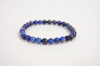 Lapis lazuli beaded bracelet from Raw Earth Crystals, featuring natural gemstones for wisdom, truth, and throat chakra balance.