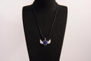 Raw Earth Crystals lapis lazuli heart with wings necklace, featuring a deep blue heart-shaped stone adorned with delicate angelic wings, designed to enhance wisdom, promote self-expression, and support spiritual insight.