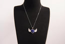 Raw Earth Crystals lapis lazuli heart with wings necklace, featuring a deep blue heart-shaped stone adorned with delicate angelic wings, designed to enhance wisdom, promote self-expression, and support spiritual insight.