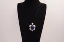 Raw Earth Crystals lapis lazuli turtle necklace crafted from natural stone to enhance wisdom, truth, and inner clarity with calming energy.