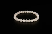 White moonstone beaded bracelet from Raw Earth Crystals, featuring natural gemstones for intuition, emotional balance, and lunar energy.