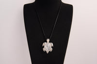 Raw Earth Crystals moonstone turtle necklace crafted from natural crystal to support intuition, emotional balance, and inner calm.