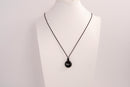 Raw Earth Crystals obsidian disc pendant necklace crafted from natural crystal for protection, grounding, and spiritual clarity.