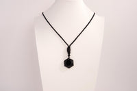 Raw Earth Crystals obsidian geometric pendant necklace crafted from natural crystal for protection, spiritual grounding, and inner clarity.