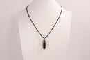 Raw Earth Crystals obsidian necklace with a pointed natural stone pendant, designed to offer protection, grounding, and emotional clarity.
