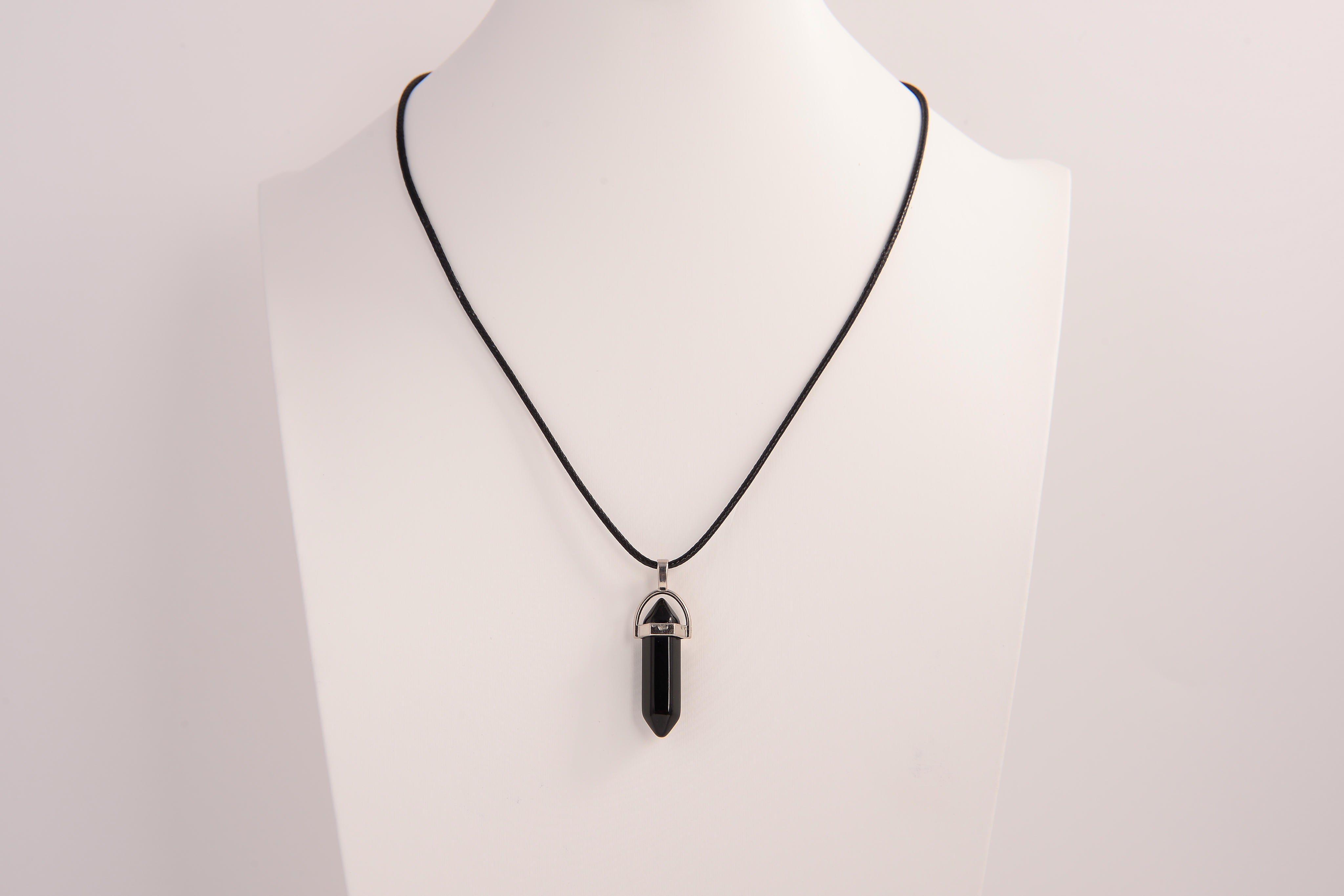 Raw Earth Crystals obsidian necklace with a pointed natural stone pendant, designed to offer protection, grounding, and emotional clarity.