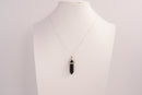 Raw Earth Crystals obsidian necklace with a pointed natural stone pendant, designed to offer protection, grounding, and emotional clarity.