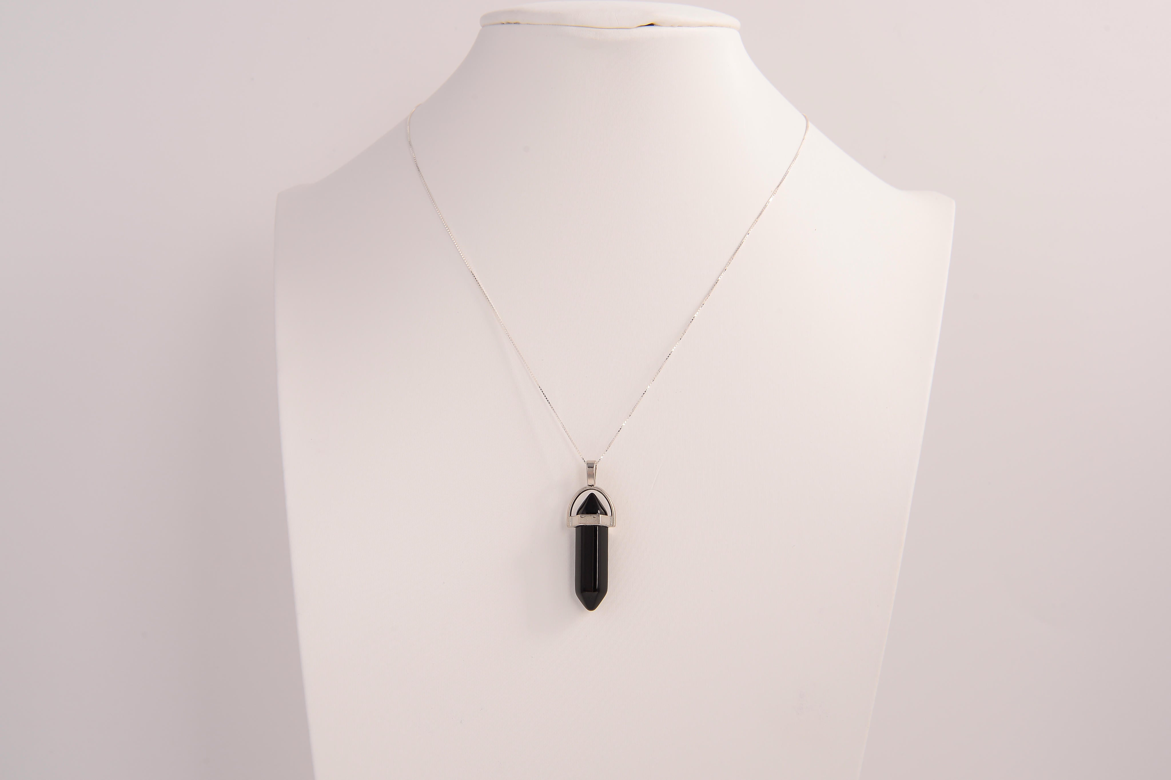 Raw Earth Crystals obsidian necklace with a pointed natural stone pendant, designed to offer protection, grounding, and emotional clarity.